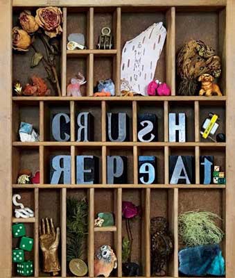 Event photo for Crush/Repeat art show featuring block letters and objects on a display box